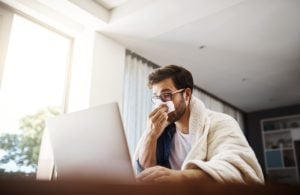 Provider performing respiratory illness evaluation for flu testing