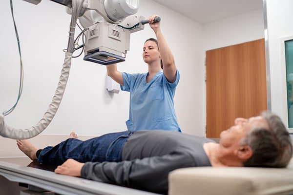EBO MD medical imaging services represented by nurse scanning patient