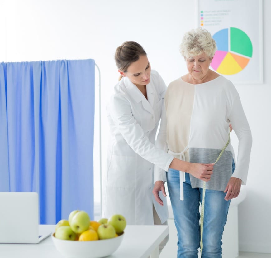 Dietician Measuring Woman's Body Circuit Dietician Measuring Woman's Body Circuit