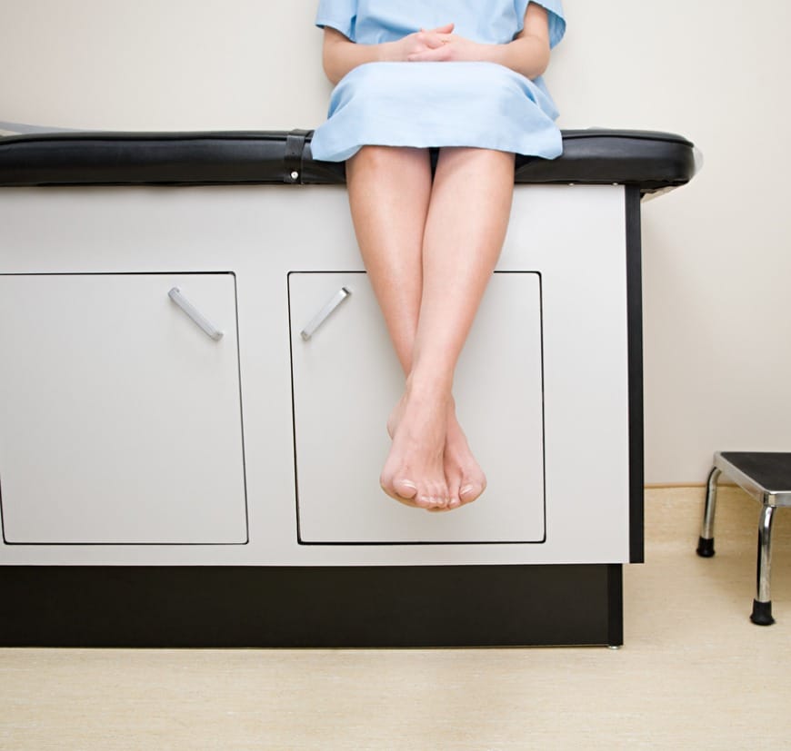 Patient Sitting on Treatment Couch Patient Sitting on Treatment Couch