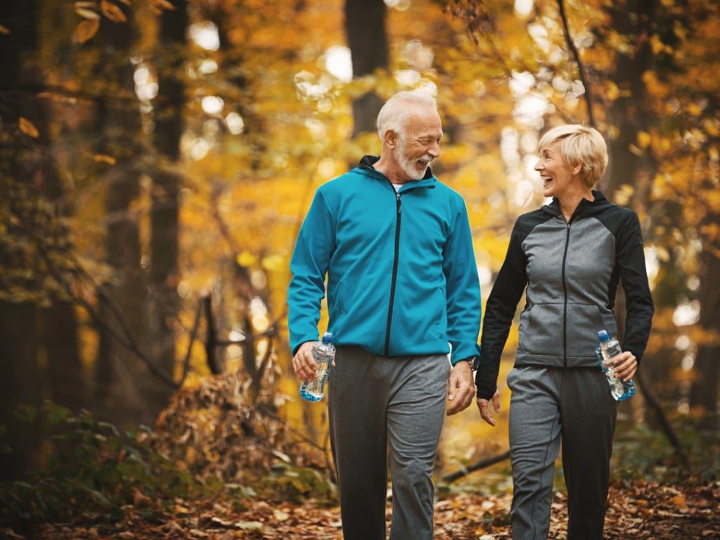 Senior Couple Walking in Forest Senior Couple Walking in Forest