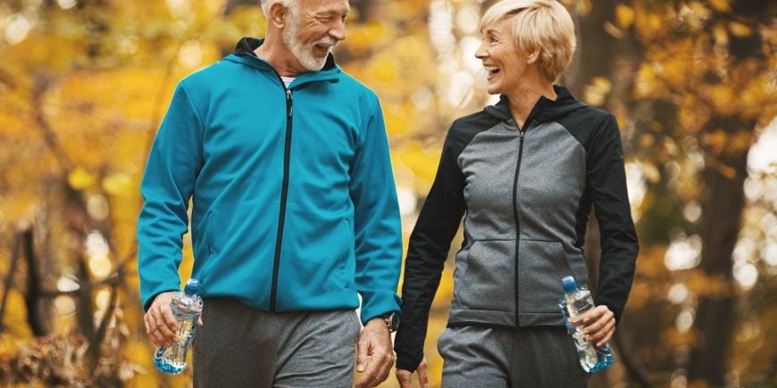 Couple Enjoying A Nature Trail Couple Enjoying A Nature Trail