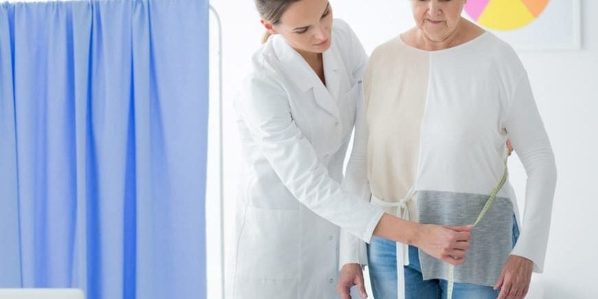 Dietician Measuring Woman's Body Circuit Dietician Measuring Woman's Body Circuit